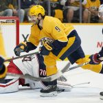 
              Nashville Predators left wing Filip Forsberg (9) scores his fourth goal of the game against the Columbus Blue Jackets in the second period of an NHL hockey game Tuesday, Nov. 30, 2021, in Nashville, Tenn. (AP Photo/Mark Humphrey)
            
