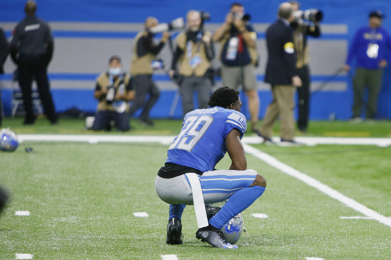 Detroit Lions cornerback Jerry Jacobs squats on the field after the Chicago Bears kicked a winning ...