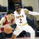 
              Alabama guard Jahvon Quinerly drives in front of Iona guard Elijah Joiner during the first half of an NCAA college basketball game Thursday, Nov. 25, 2021, in Orlando, Fla. (AP Photo/Jacob M. Langston)
            