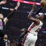 
              Miami Heat center Bam Adebayo (13) shoots over Los Angeles Clippers center Ivica Zubac during the first half of an NBA basketball game Thursday, Nov. 11, 2021, in Los Angeles. (AP Photo/Marcio Jose Sanchez)
            