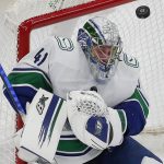 
              Vancouver Canucks' Jaroslav Halak blocks a shot during the second period of an NHL hockey game against the Boston Bruins, Sunday, Nov. 28, 2021, in Boston. (AP Photo/Michael Dwyer)
            