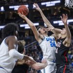 
              UCLA guard Jaime Jaquez Jr. (24) has a drive rejected by Gonzaga center Chet Holmgren (34) during the first half of an NCAA college basketball game Tuesday, Nov. 23, 2021, in Las Vegas. (AP Photo/L.E. Baskow)
            