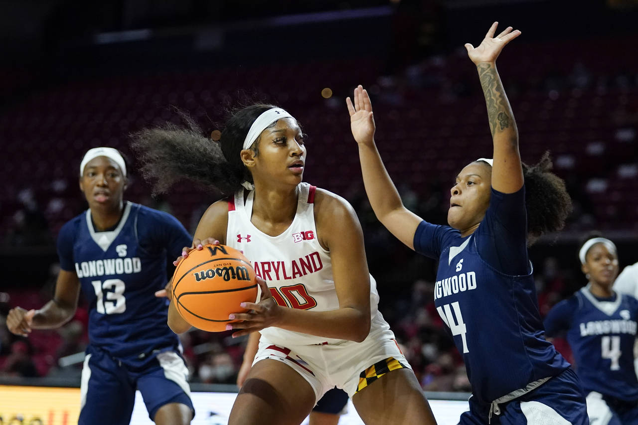 Maryland forward Angel Reese (10) attacks against Longwood guard Tra'Dayja Smith (14) during the fi...