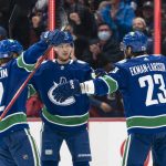 
              Vancouver Canucks' Oliver Ekman-Larsson, right, celebrates with Nils Hoglander, Vasily Podkolzin and Elias Pettersson, from left, after scoring a goal against the Winnipeg Jets during the first period of an NHL hockey game Friday, Nov. 19, 2021, in Vancouver, British Columbia. (Rich Lam/The Canadian Press via AP)
            