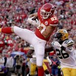 
              Kansas City Chiefs tight end Travis Kelce (87) catches a touchdown pass as Green Bay Packers safety Darnell Savage (26) defends during the first half of an NFL football game Sunday, Nov. 7, 2021, in Kansas City, Mo. (AP Photo/Charlie Riedel)
            