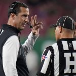 
              Cincinnati head coach Luke Fickell talks to head linesman Baron Ballester during the second half of an NCAA college football game against South Florida Friday, Nov. 12, 2021, in Tampa, Fla. (AP Photo/Chris O'Meara)
            