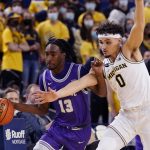 
              Tarleton State guard Shakur Daniel (13) is fouled by Michigan guard Adrien Nunez (0) during the first half of an NCAA college basketball game, Wednesday, Nov. 24, 2021, in Ann Arbor, Mich. (AP Photo/Carlos Osorio)
            