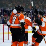 
              Philadelphia Flyers' Cam Atkinson (89) celebrates with teammates after scoring the game-winning goal during overtime in an NHL hockey game against the Calgary Flames, Tuesday, Nov. 16, 2021, in Philadelphia. (AP Photo/Matt Slocum)
            