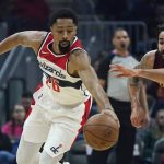 
              Washington Wizards' Spencer Dinwiddie (26) and Cleveland Cavaliers' Ricky Rubio (3) battle for a loose ball in the first half of an NBA basketball game, Wednesday, Nov. 10, 2021, in Cleveland. (AP Photo/Tony Dejak)
            