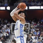 
              North Carolina's Dawson Garcia (13) makes a 3-point basket in the first half of an NCAA college basketball game against Purdue, Saturday, Nov. 20, 2021, in Uncasville, Conn. (AP Photo/Jessica Hill)
            