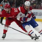 
              Detroit Red Wings center Michael Rasmussen (27) and Montreal Canadiens defenseman Ben Chiarot (8) battle for position in the third period of an NHL hockey game Saturday, Nov. 13, 2021, in Detroit. (AP Photo/Paul Sancya)
            