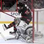 
              Ottawa Senators' Egor Sokolov (75) falls over Los Angeles Kings goaltender Jonathan Quick (32) during second-period NHL hockey game action in Ottawa, Ontario, Thursday, Nov. 11, 2021. (Justin Tang/The Canadian Press via AP)
            