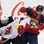 
              New Jersey Devils defenseman P.K. Subban (76) and Florida Panthers left wing Jonathan Huberdeau (11) battle for the puck during the third period of an NHL hockey game, Thursday, Nov. 18, 2021, in Sunrise, Fla. (AP Photo/Wilfredo Lee)
            