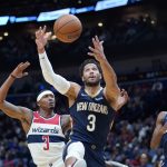 
              New Orleans Pelicans guard Josh Hart (3) chases down a rebound in front of Washington Wizards guard Bradley Beal (3) in the first half of an NBA basketball game in New Orleans, Wednesday, Nov. 24, 2021. (AP Photo/Gerald Herbert)
            