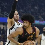 
              Cleveland Cavaliers' Jarrett Allen, right, tries to get past Brooklyn Nets' Blake Griffin during the first half of an NBA basketball game Monday, Nov. 22, 2021, in Cleveland. (AP Photo/Tony Dejak)
            