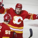 
              Calgary Flames' Milan Lucic, right, celebrates his goal against the Chicago Blackhawks with Noah Hanifin during the first period of an NHL hockey game Tuesday, Nov. 23, 2021, in Calgary, Alberta. /The Canadian Press via AP)
            