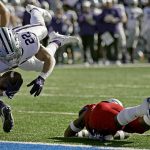 
              Kansas State running back Deuce Vaughn (22) dives into the end zone to score a touchdown during the second half of an NCAA football game against Kansas Saturday, Nov. 6, 2021, in Lawrence, Kan. (AP Photo/Charlie Riedel)
            