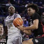 
              Alcorn State guard Dominic Brewton (15) and Gonzaga forward Anton Watson, right, go after a rebound during the second half of an NCAA college basketball game, Monday, Nov. 15, 2021, in Spokane, Wash. (AP Photo/Young Kwak)
            