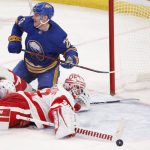 
              Buffalo Sabres center Arttu Ruotsalainen (25) puts the puck past Detroit Red Wings goaltender Alex Nedeljkovic (39) during the third period of an NHL hockey game, Saturday, Nov. 6, 2021, in Buffalo, N.Y. (AP Photo/Jeffrey T. Barnes)
            