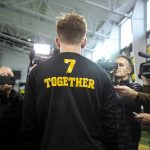 
              Iowa quarterback Spencer Petras wears a shirt that reads "Together" as he speaks to reporters ahead of the NCAA college football Big Ten Championship against Michigan, Tuesday, Nov. 30, 2021, at the Hansen Football Performance Center in Iowa City, Iowa. (Joseph Cress/Iowa City Press-Citizen via AP)
            