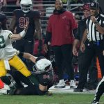 
              Green Bay Packers quarterback Aaron Rodgers looks for a call as Arizona Cardinals defensive end Zach Allen (94) makes the tackle during the second half of an NFL football game, Thursday, Oct. 28, 2021, in Glendale, Ariz. The Packers won 24-21. (AP Photo/Rick Scuteri)
            