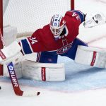 
              Montreal Canadiens goaltender Jake Allen deflects a shot during the second period of an NHL hockey game against the Los Angeles Kings, Tuesday, Nov. 9, 2021, in Montreal. (Paul Chiasson/The Canadian Press via AP)
            
