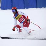 
              Beat Feuz, of Switzerland, eases up in the finish area during the men's World Cup downhill ski race in Lake Louise, Alberta, Saturday, Nov. 27, 2021. (Jeff McIntosh/The Canadian Press via AP)
            