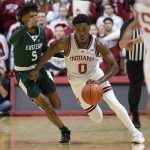 
              Indiana guard Xavier Johnson (0) brings the ball up next to Eastern Michigan guard Noah Farrakhan (5) during the second half of an NCAA college basketball game in Bloomington, Ind., Tuesday, Nov. 9, 2021. Indiana won 68-62. (AP Photo/AJ Mast)
            