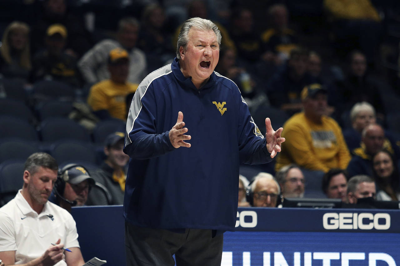West Virginia coach Bob Huggins reacts during the second half of an NCAA college basketball game ag...