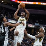 
              Indiana Pacers center Myles Turner (33) shoots over San Antonio Spurs guard Devin Vassell (24) during the second half of an NBA basketball game in Indianapolis, Monday, Nov. 1, 2021. The Pacers defeated the Spurs 131-118. (AP Photo/Michael Conroy)
            