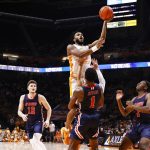 
              Tennessee guard Josiah-Jordan James (30) shoots over Tennessee-Martin guard Koby Jeffries (1) during an NCAA college basketball game Tuesday, Nov. 9, 2021, in Knoxville, Tenn. (AP Photo/Wade Payne)
            