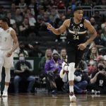 
              Milwaukee Bucks' Giannis Antetokounmpo (34) points after making a basket during the first half of an NBA basketball game against the Oklahoma City Thunder, Friday, Nov. 19, 2021, in Milwaukee. (AP Photo/Aaron Gash)
            