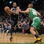 
              Brooklyn Nets forward Kevin Durant (7) drives to the basket against Boston Celtics forward Jabari Parker (20) during the second half of an NBA basketball game, Wednesday, Nov. 24, 2021, in Boston. (AP Photo/Charles Krupa)
            