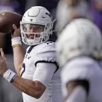 
              West Virginia quarterback Jarret Doege throws during the first half of an NCAA college football game against Kansas State, Saturday, Nov. 13, 2021, in Manhattan, Kan. (AP Photo/Charlie Riedel)
            