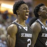 
              St. Bonaventure's Quadry Adams (2) and Linton Brown (4) cheer during an NCAA college basketball game against Boise State at the Charleston Classic in Charleston, S.C., Thursday, Nov. 18, 2021. (Andrew J. Whitaker/The Post And Courier via AP)
            