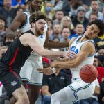 
              Gonzaga forward Drew Timme (2) loses the ball to UCLA guard Jules Bernard (1) during the first half of an NCAA college basketball game Tuesday, Nov. 23, 2021, in Las Vegas. (AP Photo/L.E. Baskow)
            