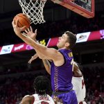 
              Northern Iowa forward Cole Henry (1) drives between two Arkansas defenders to score in the second half of an NCAA college basketball game Wednesday, Nov. 17, 2021, in Fayetteville, Ark. (AP Photo/Michael Woods)
            
