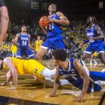 
              Seton Hall center Ike Obiagu (21) grabs a rebound over guard Bryce Aiken, bottom right, and Michigan center Hunter Dickinson, bottom left, during the second half of an NCAA college basketball game at Crisler Center in Ann Arbor, Mich., Tuesday, Nov. 16, 2021. (AP Photo/Tony Ding)
            