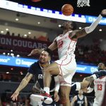 
              Rice guard Noah Hutchins (1) is fouled by Houston forward Reggie Chaney during the first half of an NCAA college basketball game Friday, Nov. 12, 2021, in Houston. (AP Photo/Justin Rex)
            
