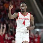 
              Houston guard Taze Moore reacts after making a 3-point basket during the first half of the team's NCAA college basketball game against Virginia, Tuesday, Nov. 16, 2021, in Houston. (AP Photo/Eric Christian Smith)
            