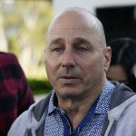 
              New York Yankees general manager Brian Cashman talks with reporters during Major League Baseball's general managers meetings Tuesday, Nov. 9, 2021, in Carlsbad, Calif. (AP Photo/Gregory Bull)
            