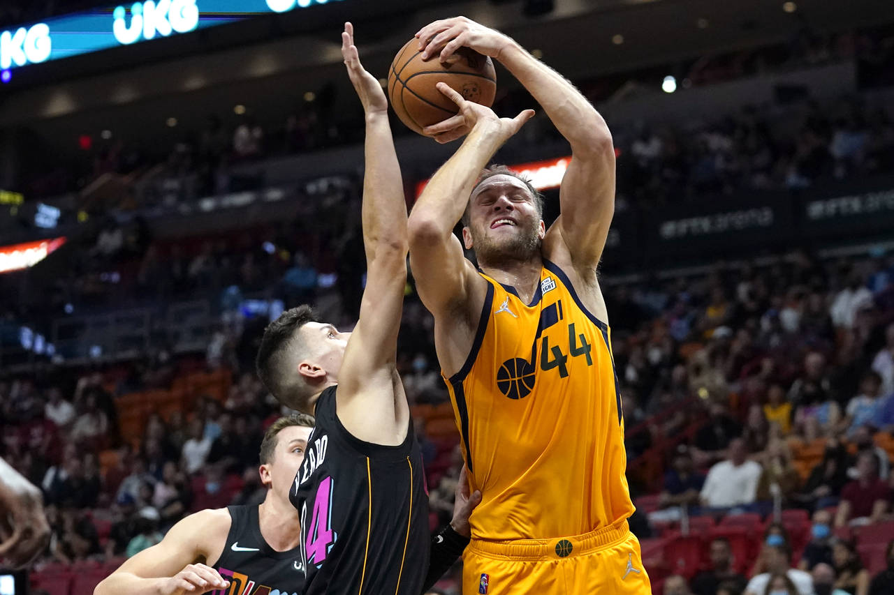 Utah Jazz forward Bojan Bogdanovic (44) is fouled by Miami Heat guard Tyler Herro (14) during the f...