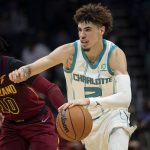 
              Charlotte Hornets guard LaMelo Ball (2) drives past Cleveland Cavaliers guard Darius Garland (10) during the first half of an NBA basketball game, Monday, Nov. 1, 2021, in Charlotte, N.C. (AP Photo/Matt Kelley)
            