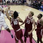 
              Kansas State's Selton Miguel (3) gets past a group of Arkansas defenders to put up aq shot during the first half of an NCAA college basketball game Monday, Nov. 22, 2021, in Kansas City, Mo. (AP Photo/Charlie Riedel)
            