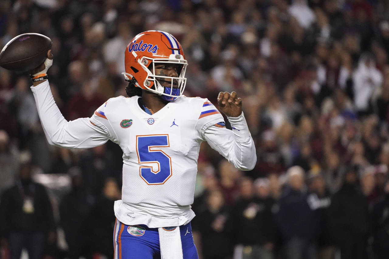 Florida quarterback Emory Jones throws a pass during the first half of the team's NCAA college foot...