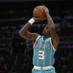 
              Charlotte Hornets guard Terry Rozier (3) shoots during the second half of the team's NBA basketball game against the Washington Wizards, Monday, Nov. 22, 2021, in Washington. (AP Photo/Nick Wass)
            