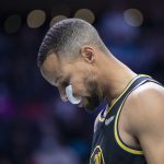 
              Golden State Warriors guard Stephen Curry (30) takes a moment prior to an NBA basketball game against the Charlotte Hornets, Sunday, Nov. 14, 2021, in Charlotte, N.C. (AP Photo/Matt Kelley)
            