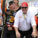 
              FILE - Jamie McMurray, left, and car owner Chip Ganassi celebrate on the start-finish line after McMurray won the NASCAR Brickyard 400 auto race at Indianapolis Motor Speedway in Indianapolis, Sunday, July 25, 2010. Chip Ganassi will close his 20-year run in NASCAR in Sunday’s, Nov. 7, 2021, season finale. (AP Photo/Tom Strickland, File)
            