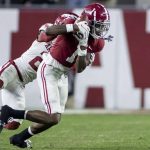 
              Alabama wide receiver Jameson Williams (1) makes a catch with Arkansas defensive back Montaric Brown (21) defending during the second half of an NCAA college football game Saturday, Nov. 20, 2021, in Tuscaloosa, Ala. (AP Photo/Vasha Hunt)
            