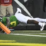 
              Oregon quarterback Anthony Brown gets the ball into the end zone to score during the third quarter of the team's NCAA college football game against Washington State on Saturday, Nov. 13, 2021, in Eugene, Ore. (AP Photo/Andy Nelson)
            